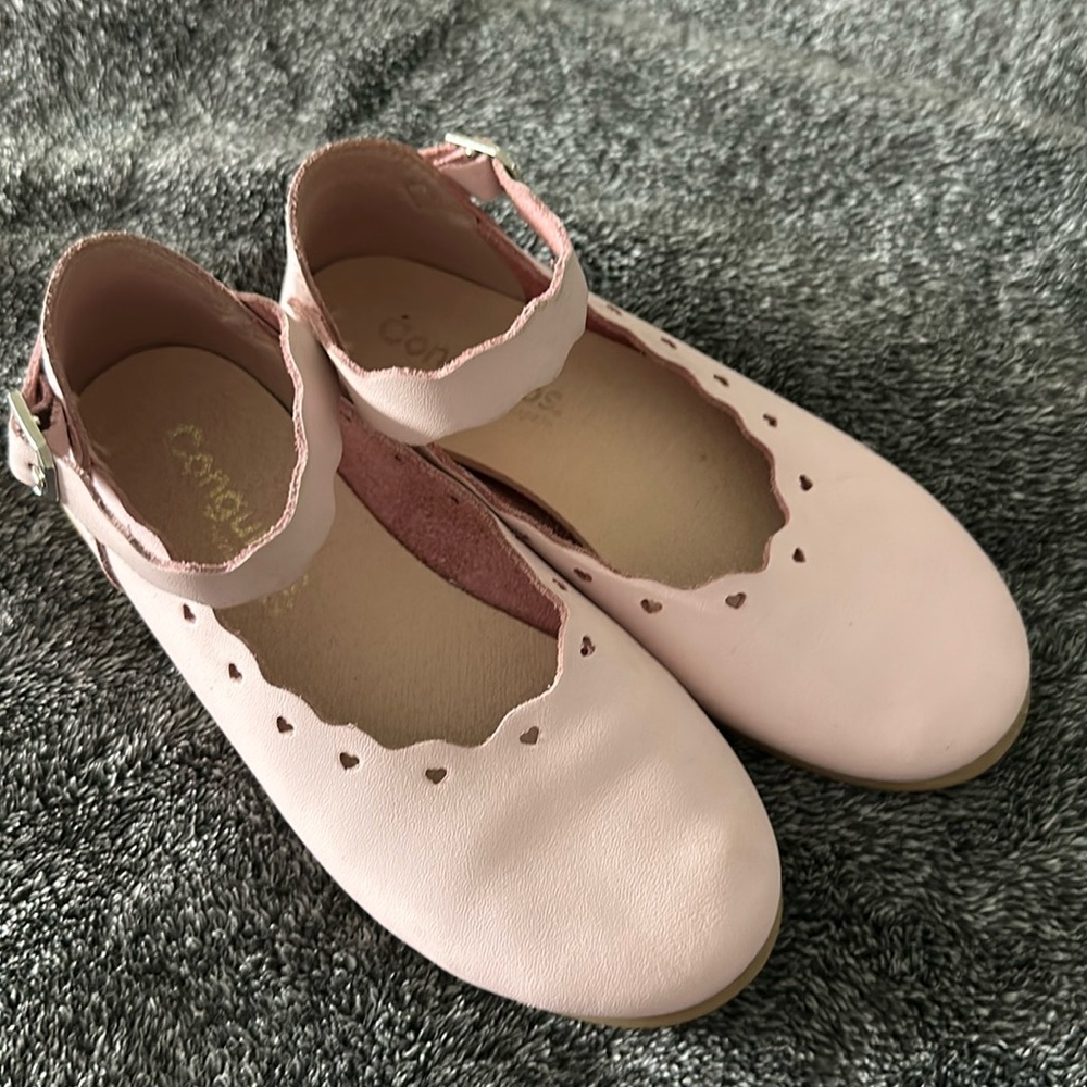 Ballerina pink leather shoes.